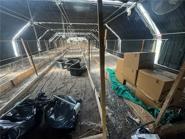 a view of a swimming pool with a yard