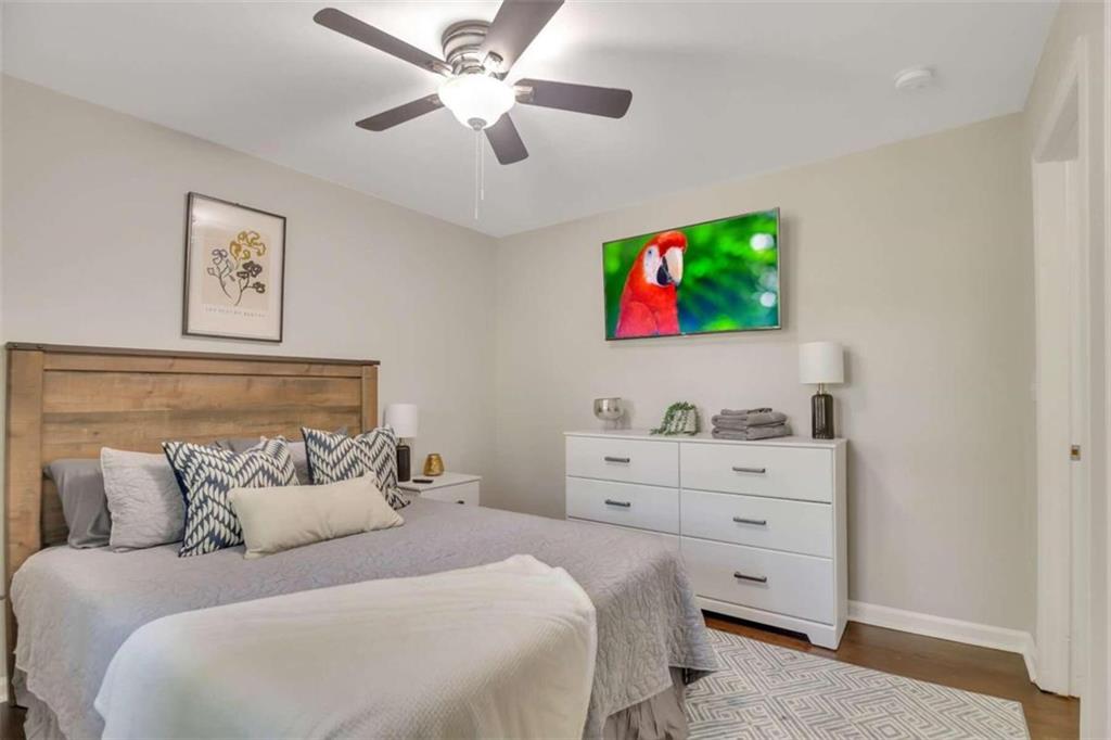 1386 Sandtown Road Southwest Marietta, GA 30008 - Photo 17 of 23 a bedroom with a bed and a window