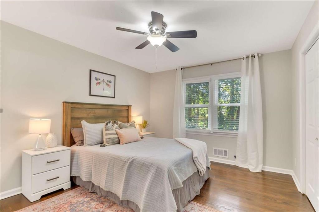 1386 Sandtown Road Southwest Marietta, GA 30008 - Photo 18 of 23 a bedroom with a large bed and a window