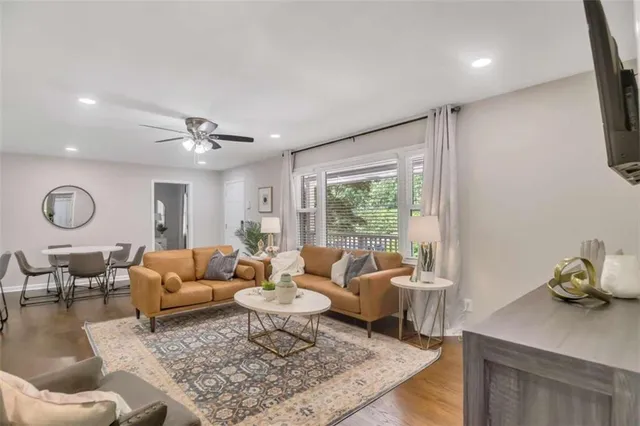 a living room with furniture and a table