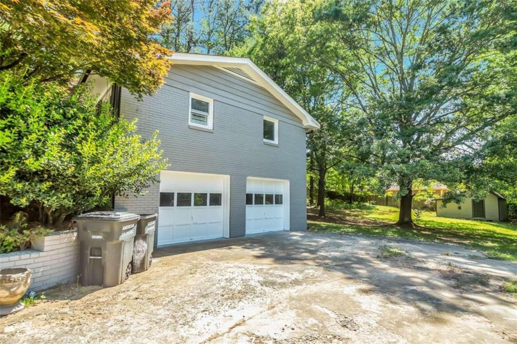 1386 Sandtown Road Southwest Marietta, GA 30008 - Photo 21 of 23 a view of a house with a yard