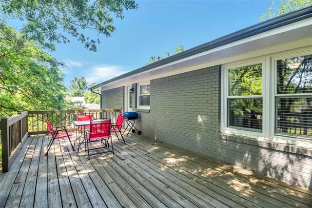 a backyard of a house with outdoor seating