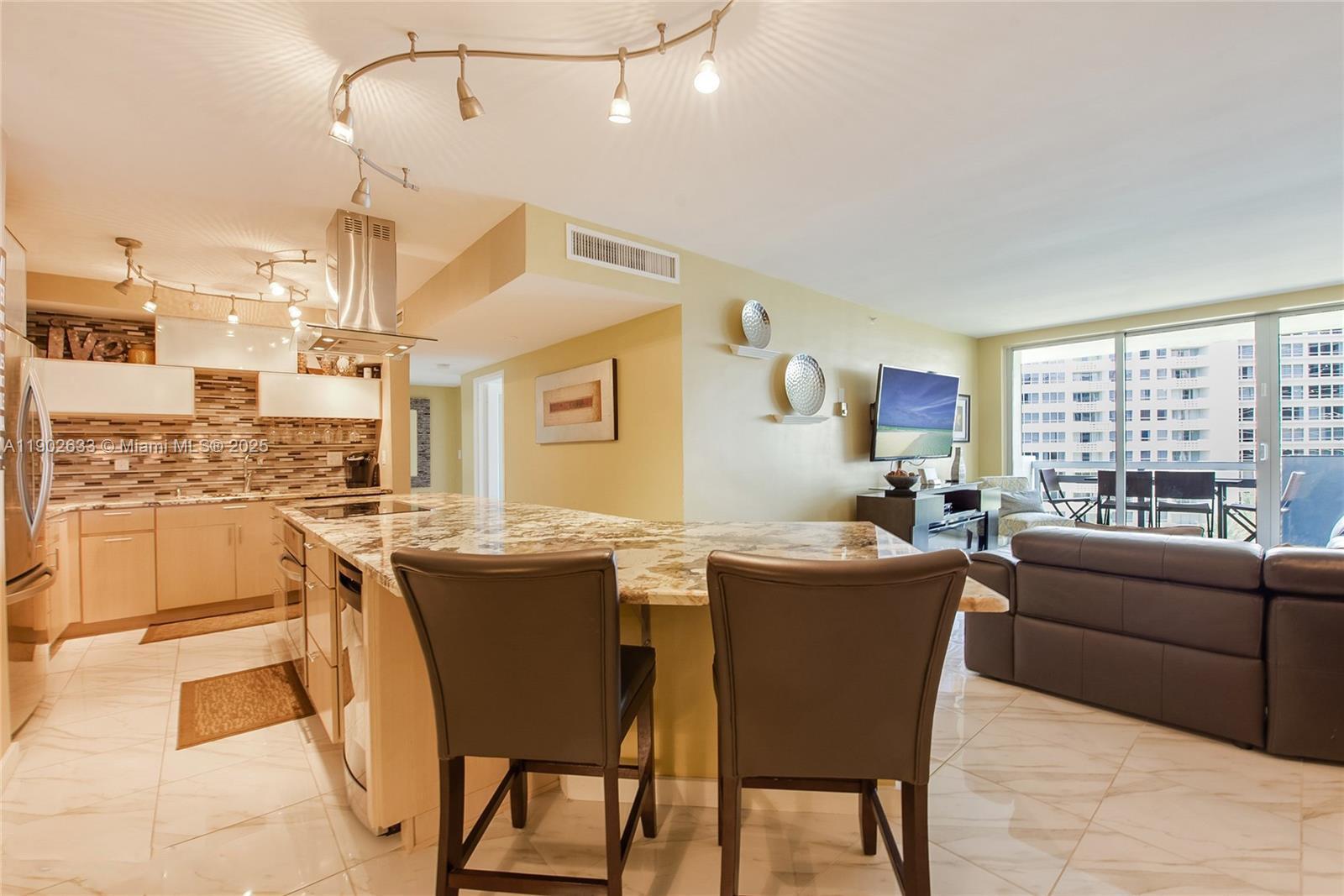 1500 Bay Road, Unit 846S Miami Beach, FL 33139 - Photo 7 of 40 a view of a dining room with furniture window and outside view