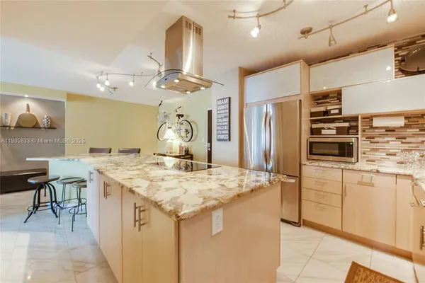 a kitchen with a table and chairs in it