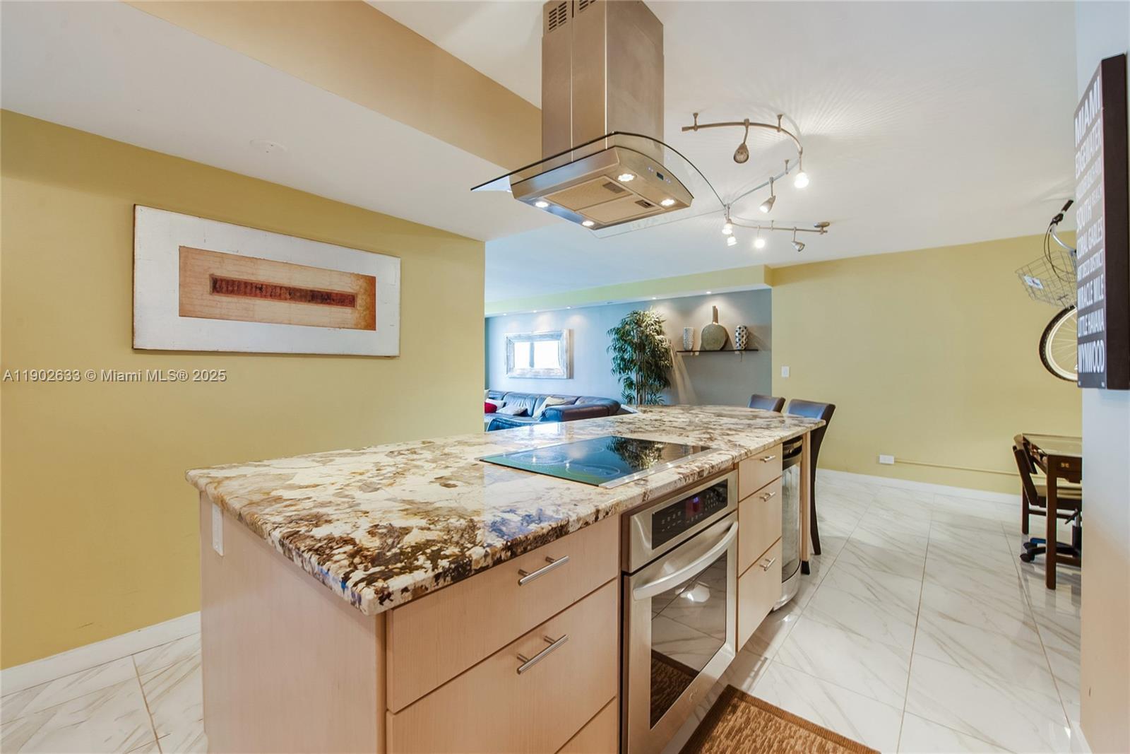 1500 Bay Road, Unit 846S Miami Beach, FL 33139 - Photo 9 of 40 a kitchen with a table and chairs in it