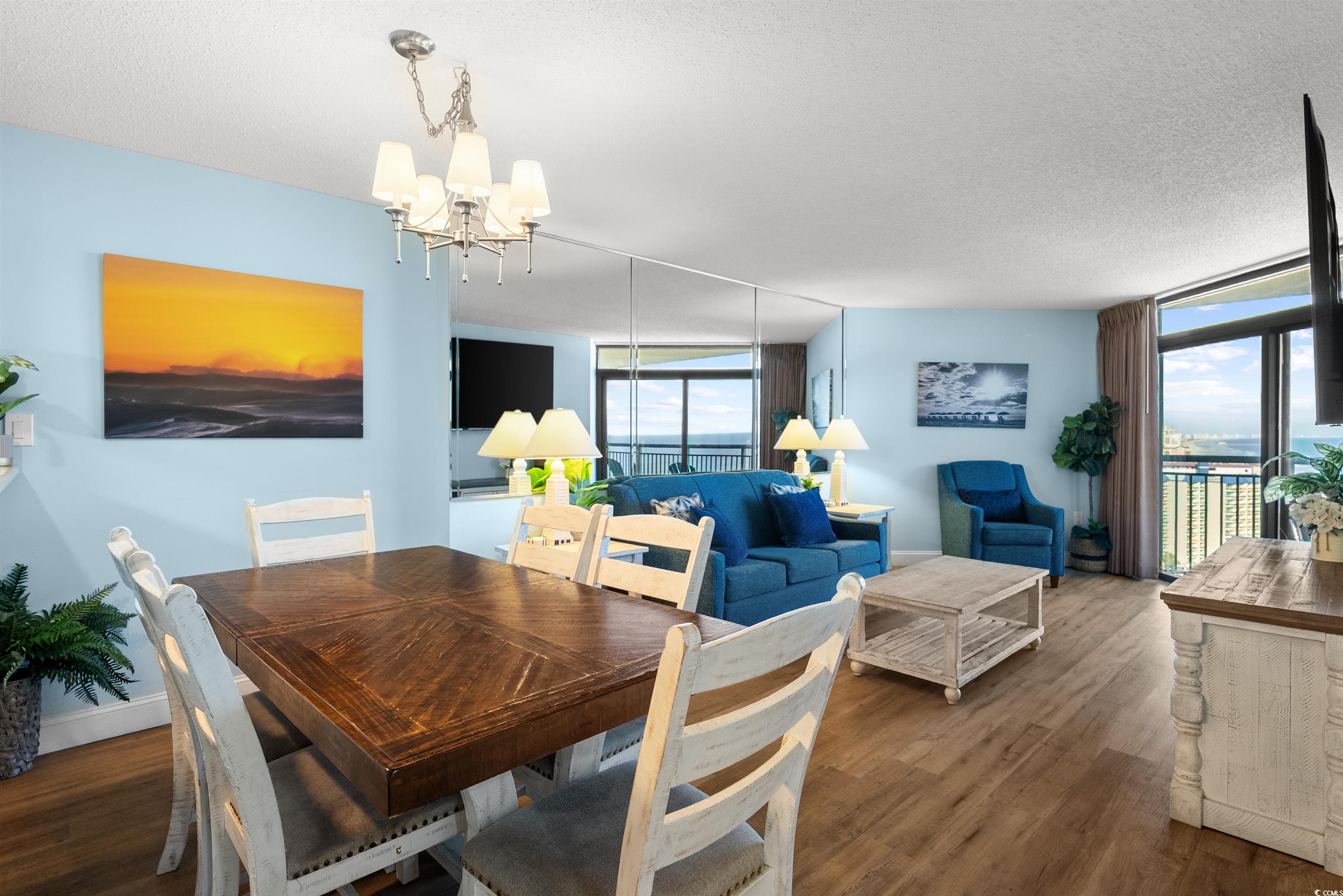 205 74th Avenue North, Unit 1908 Myrtle Beach, SC 29572 - Photo 13 of 39 Dining area featuring dark wood-type flooring, floor to ceiling windows, a textured ceiling, and a chandelier