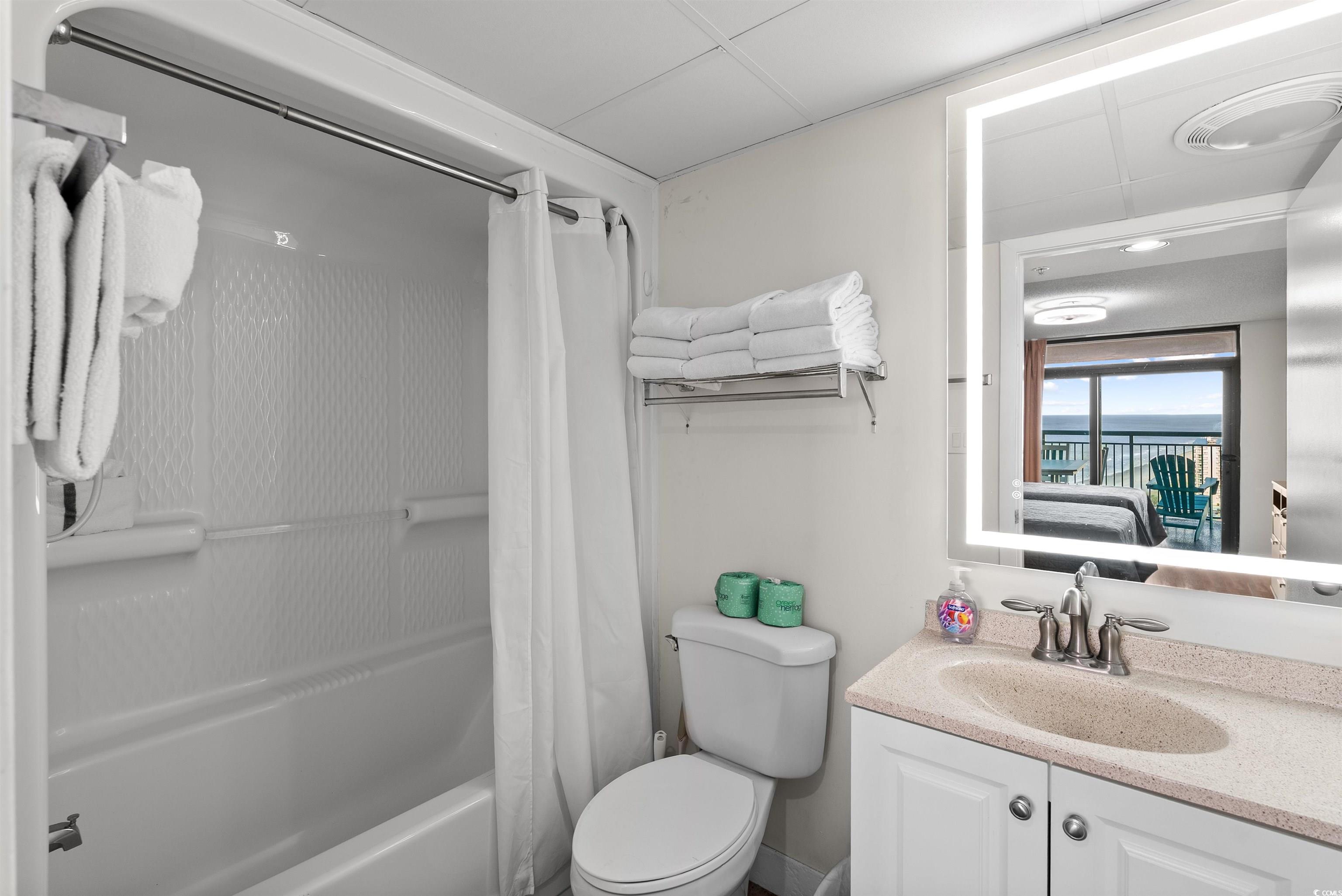 205 74th Avenue North, Unit 1908 Myrtle Beach, SC 29572 - Photo 27 of 39 Ensuite bathroom with shower / bathtub combination with curtain and vanity