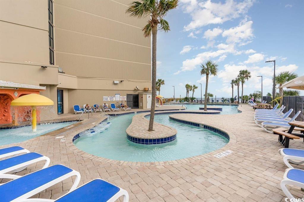 205 74th Avenue North, Unit 1908 Myrtle Beach, SC 29572 - Photo 35 of 39 Community pool with a patio