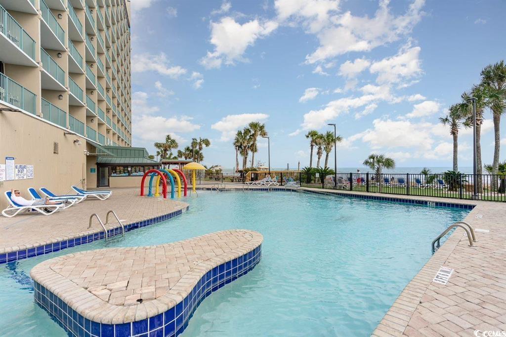 205 74th Avenue North, Unit 1908 Myrtle Beach, SC 29572 - Photo 36 of 39 Community pool with a patio