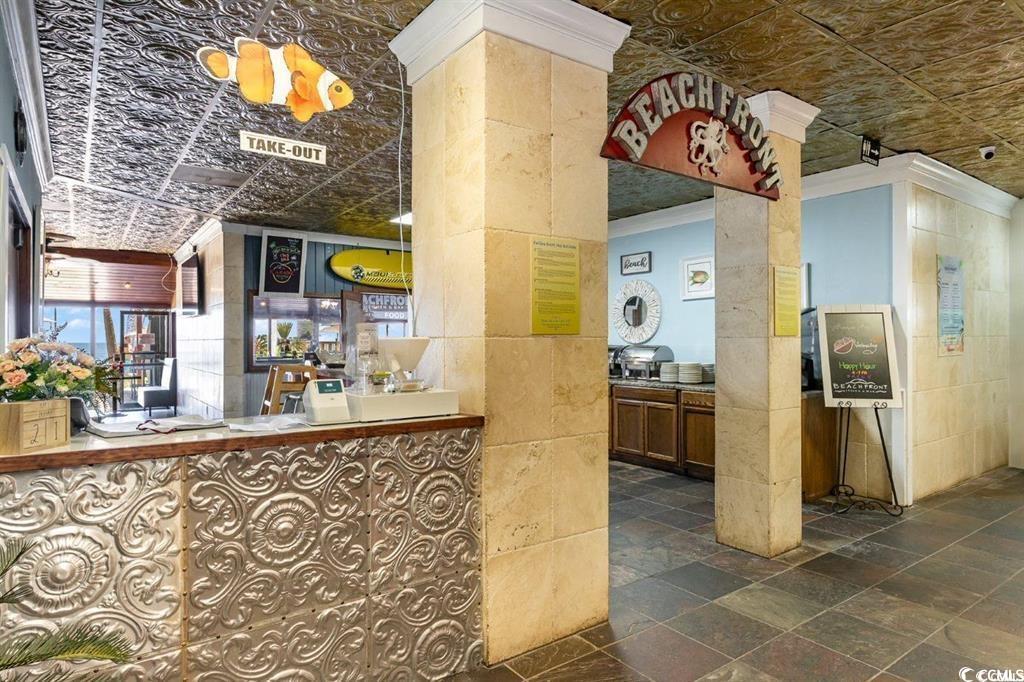 205 74th Avenue North, Unit 1908 Myrtle Beach, SC 29572 - Photo 37 of 39 Reception with an ornate ceiling, tile walls, and crown molding