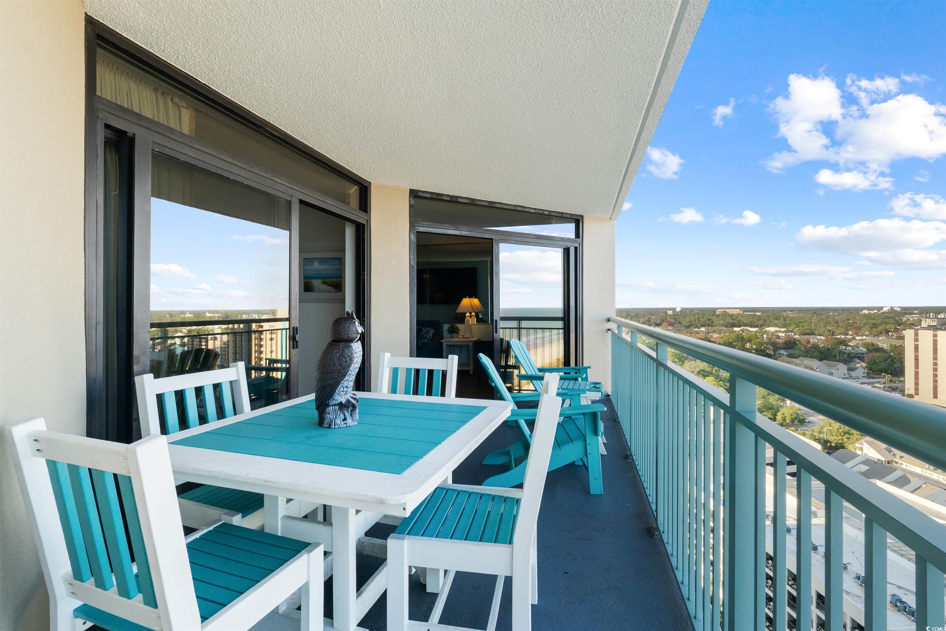 205 74th Avenue North, Unit 1908 Myrtle Beach, SC 29572 - Photo 4 of 39 Balcony with a sunroom and outdoor dining area