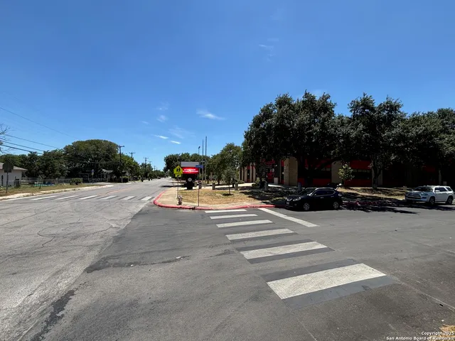 a view of a large body of water with a house in the background