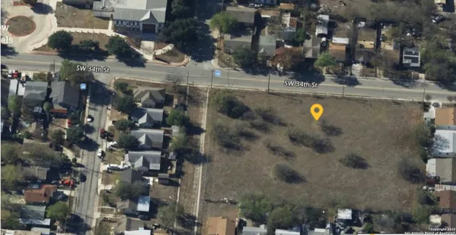 a view of a street with a building in the background