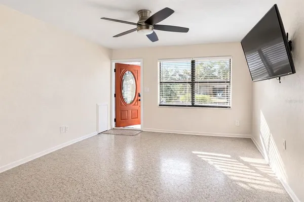 a view of an empty room with a window