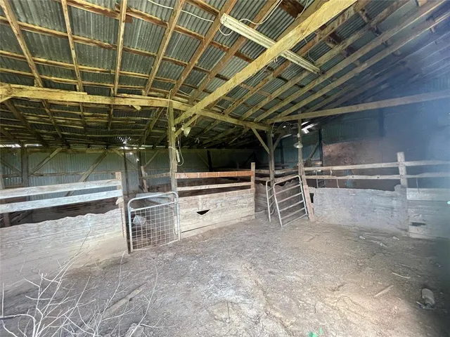 a view of an empty room with a garage