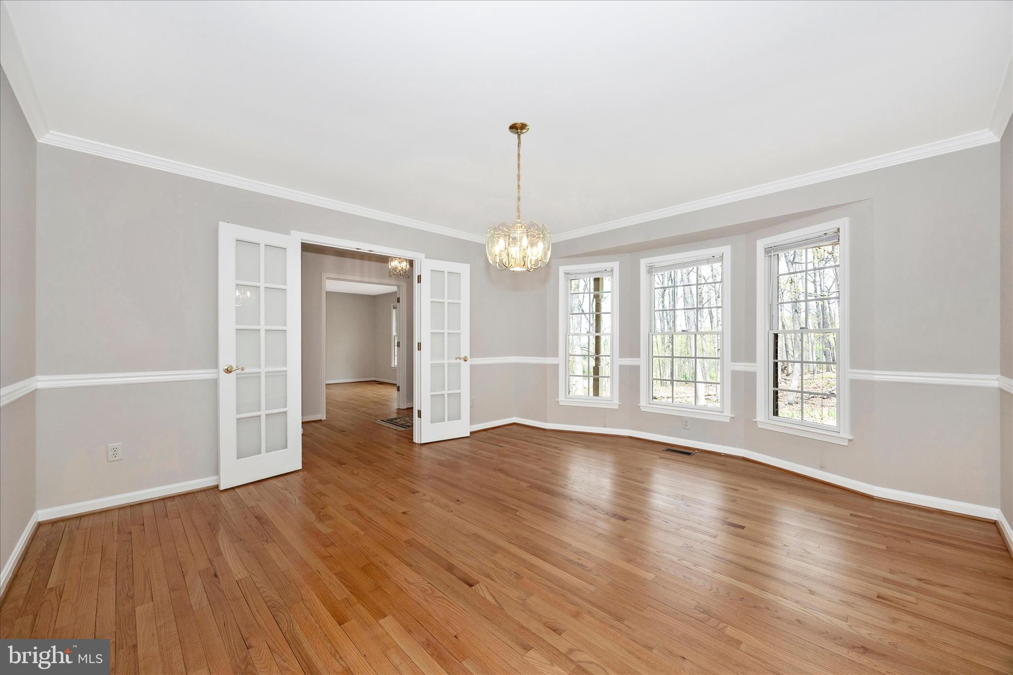 10393 Liberty Road Frederick, MD 21701 - Photo 20 of 47 a view of an empty room with wooden floor and a window