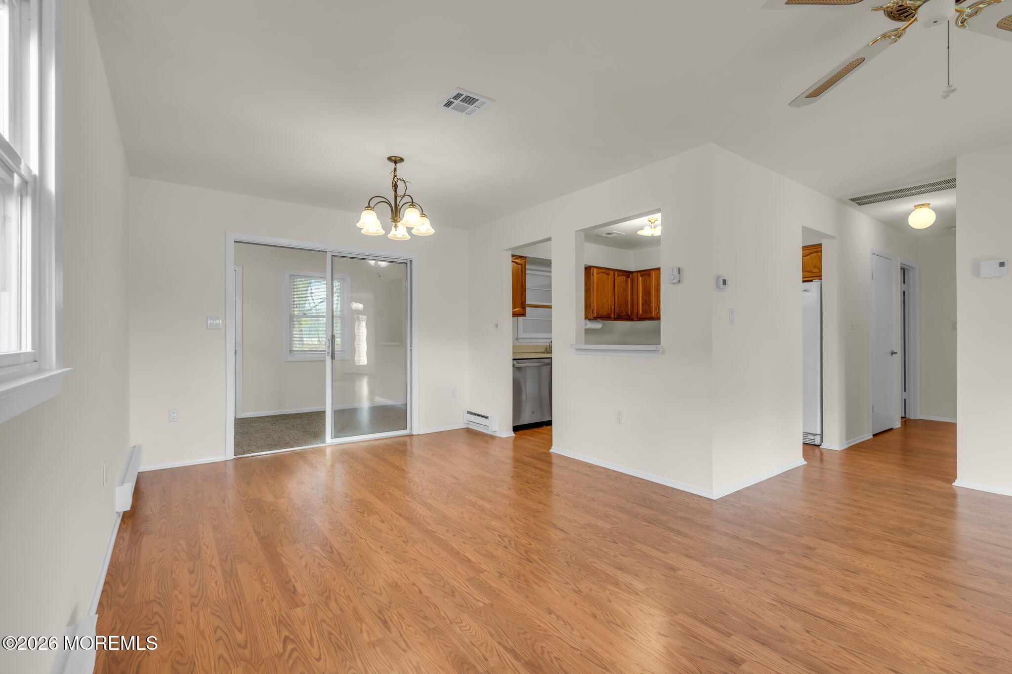 14 Thames Place Brick, NJ 08723 - Photo 12 of 37 a view of an empty room with wooden floor and a window
