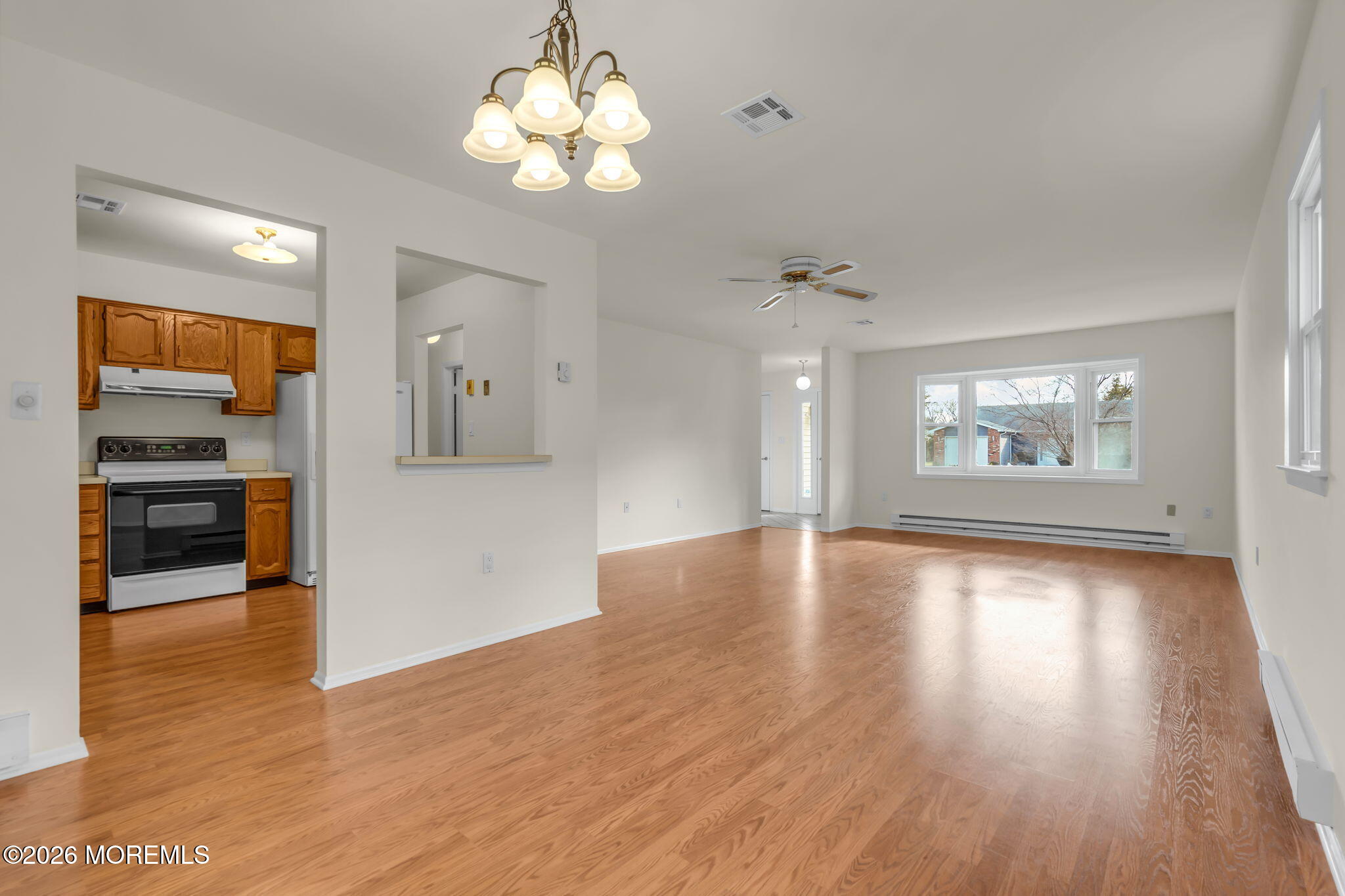 14 Thames Place Brick, NJ 08723 - Photo 13 of 37 a view of an empty room with a window and wooden floor