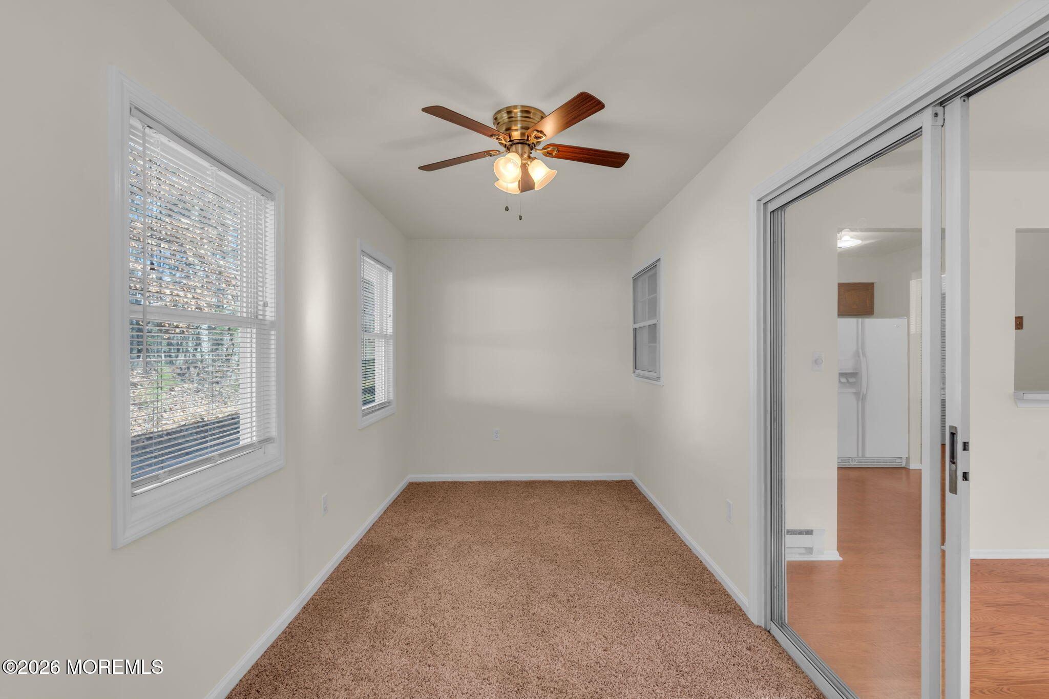 14 Thames Place Brick, NJ 08723 - Photo 17 of 37 a view of a livingroom with a window and a ceiling fan
