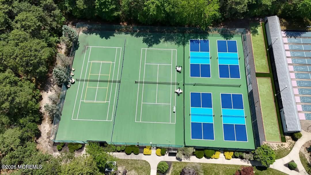14 Thames Place Brick, NJ 08723 - Photo 26 of 37 a green building with trees in front of it
