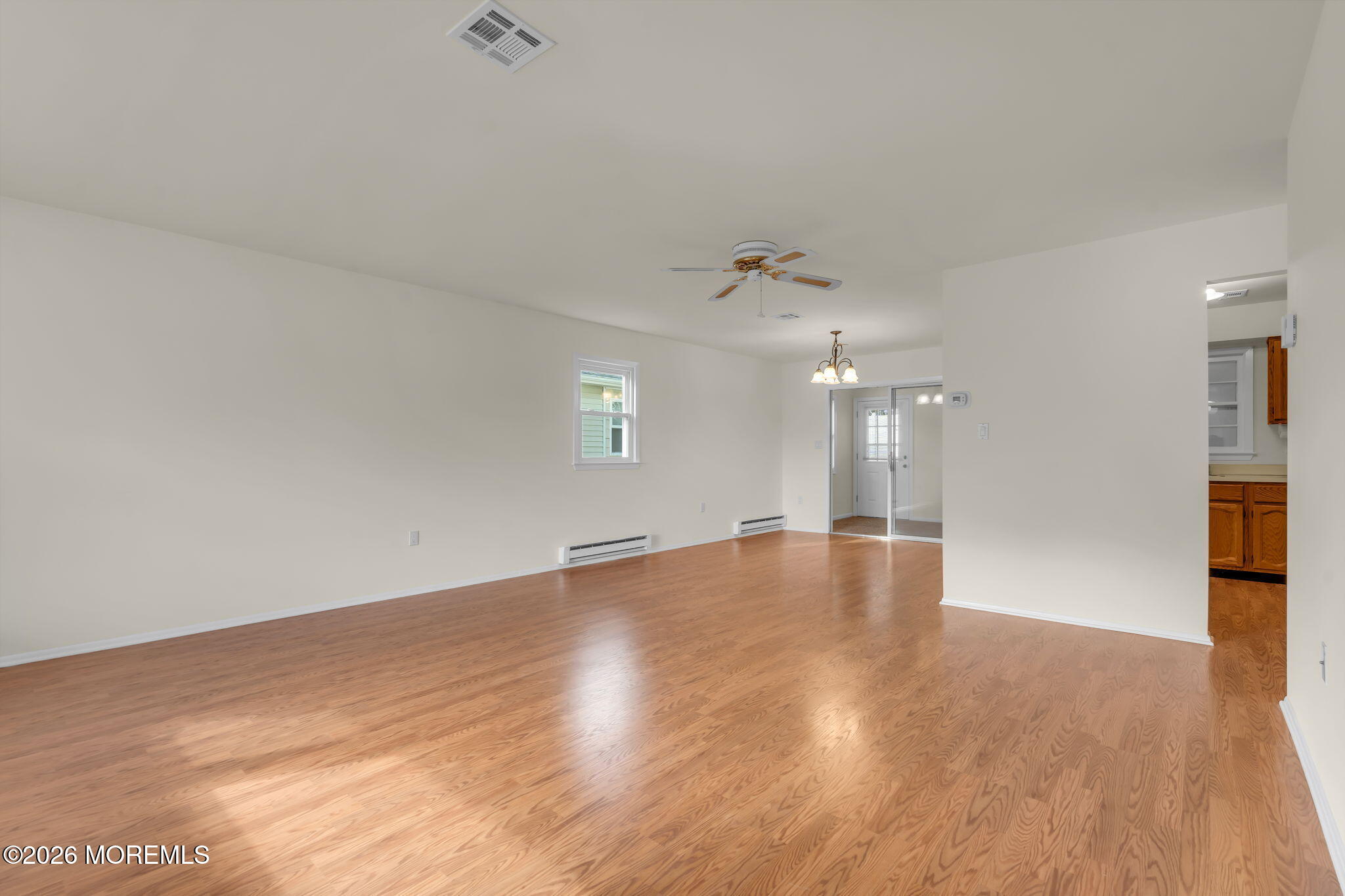 14 Thames Place Brick, NJ 08723 - Photo 7 of 37 an empty room with wooden floor and windows