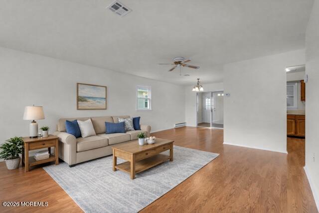 14 Thames Place Brick, NJ 08723 - Photo 8 of 37 a living room with furniture and a chandelier