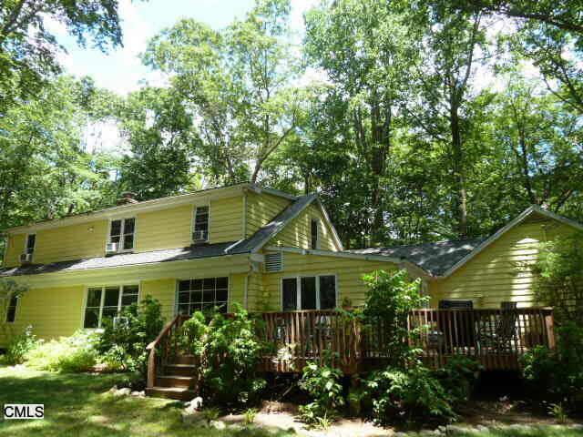 161 Linden Tree Road Wilton, CT 06897 - Photo 1 of 1 a front view of a house with garden