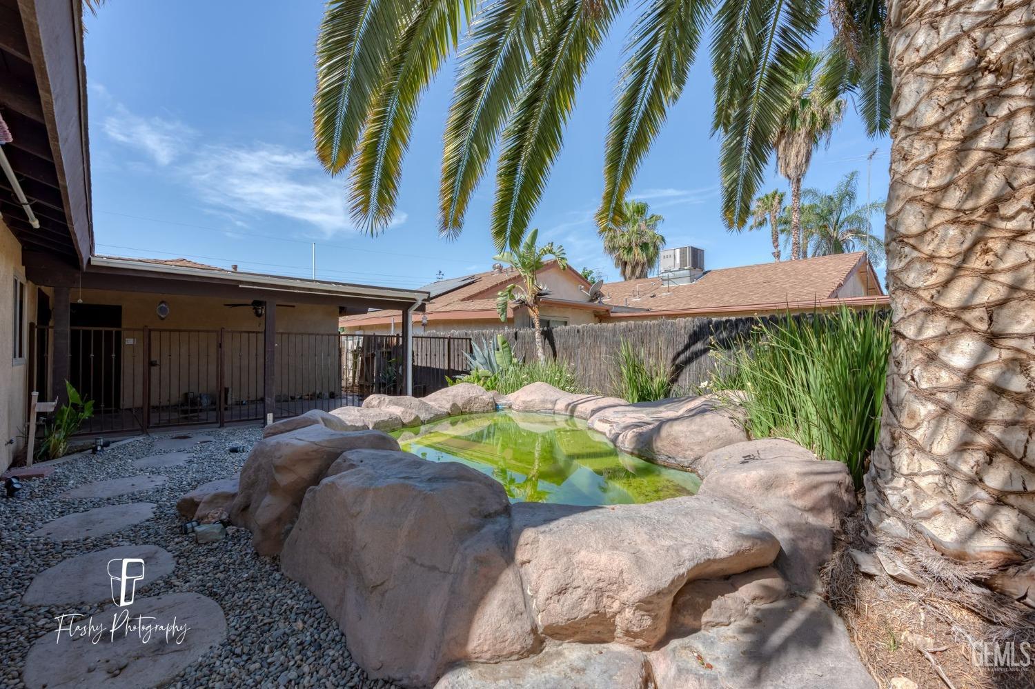 Undisclosed Address Bakersfield, CA 93309 - Photo 28 of 32 a view of backyard with outdoor seating and plants