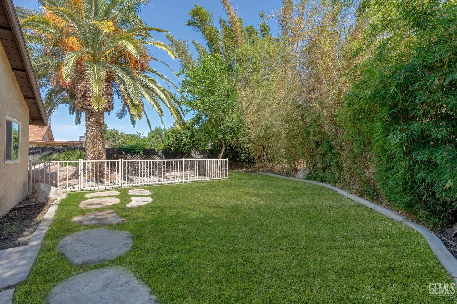 Undisclosed Address Bakersfield, CA 93309 - Photo 31 of 32 a view of a backyard with swimming pool