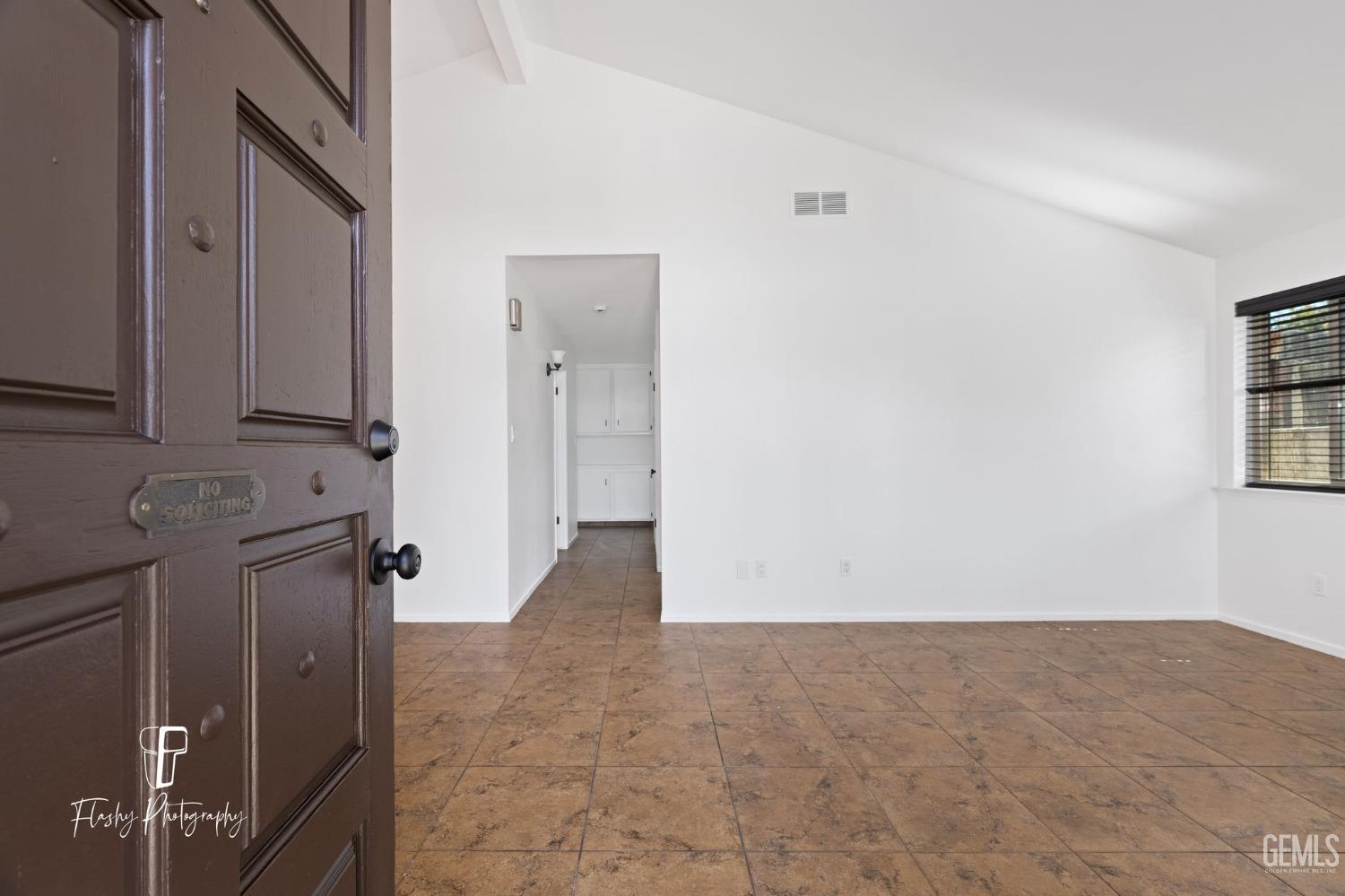 Undisclosed Address Bakersfield, CA 93309 - Photo 6 of 32 a view of a hallway with closet