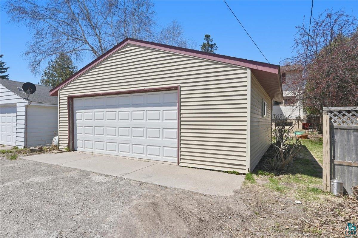 1918 West Kent Road Duluth, MN 55812 - Photo 34 of 42 Detached garage featuring panel siding and a segmented overhead door