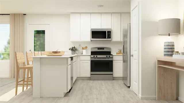 a kitchen with a sink stove and refrigerator