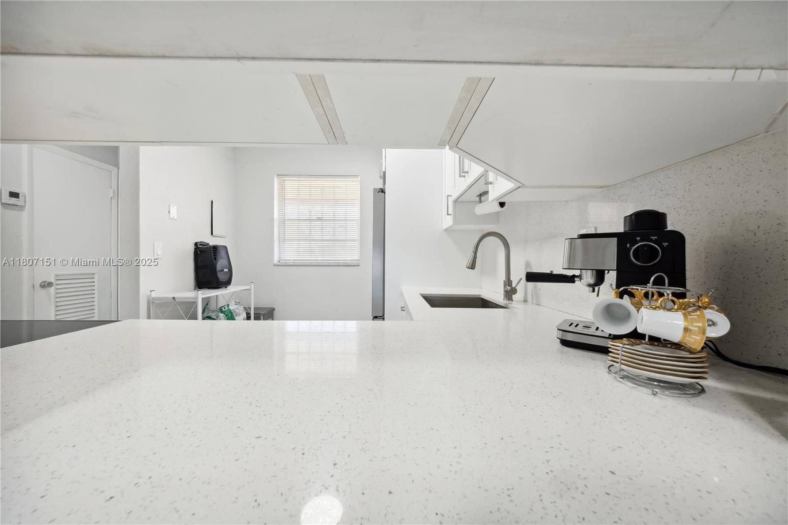 140 Royal Palm Road, Unit 3144 Hialeah Gardens, FL 33016 - Photo 12 of 23 a room with gym equipment and a large window