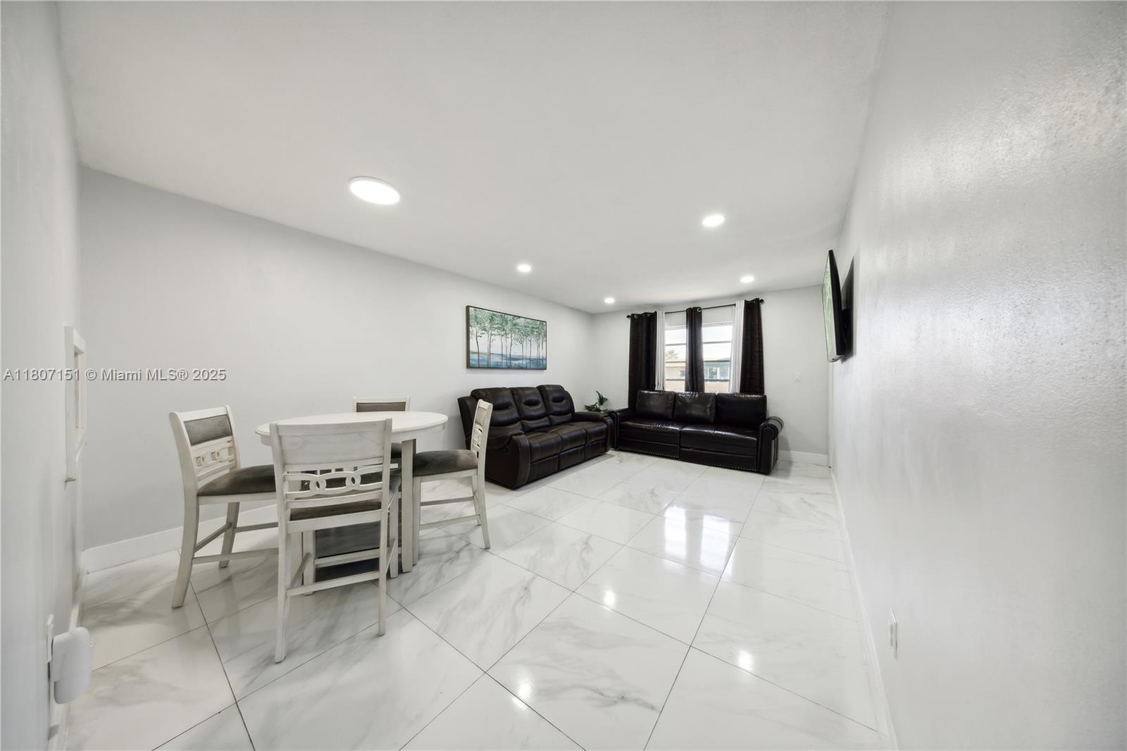 140 Royal Palm Road, Unit 3144 Hialeah Gardens, FL 33016 - Photo 16 of 23 a living room with furniture and a wooden floor