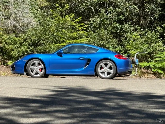 a front view of a house with parking space