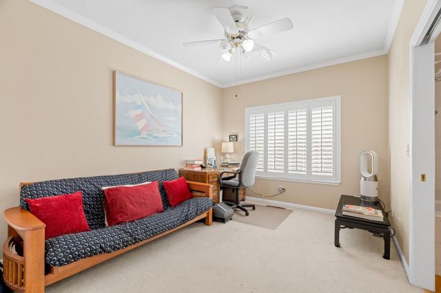 a living room with a couch and a window