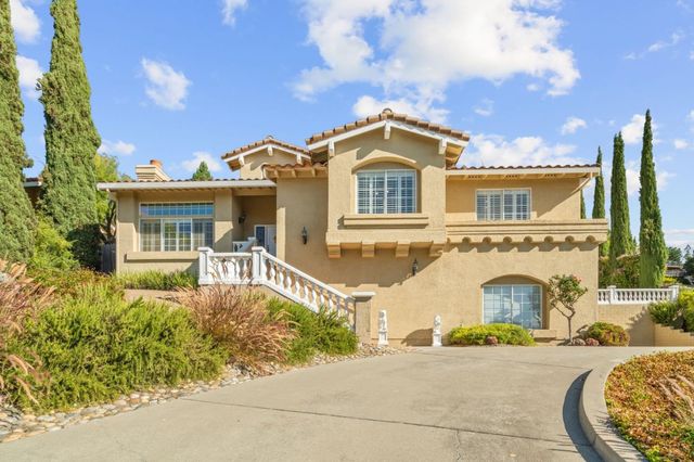 front view of a house with a garden