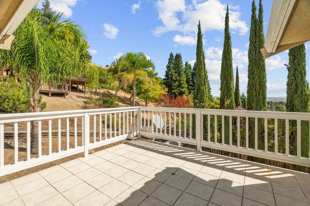 a view of a balcony with wooden floor