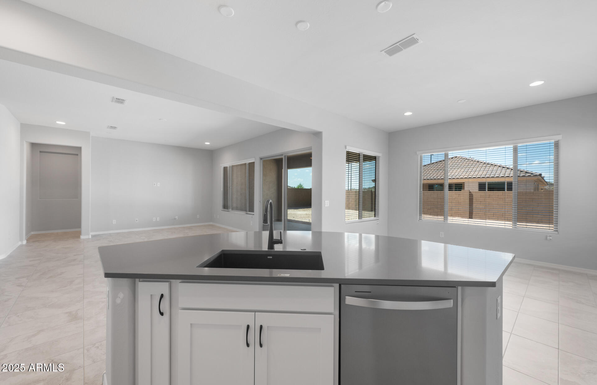 7906 West Mockingbird Way Florence, AZ 85132 - Photo 15 of 36 a kitchen with counter top space and living room