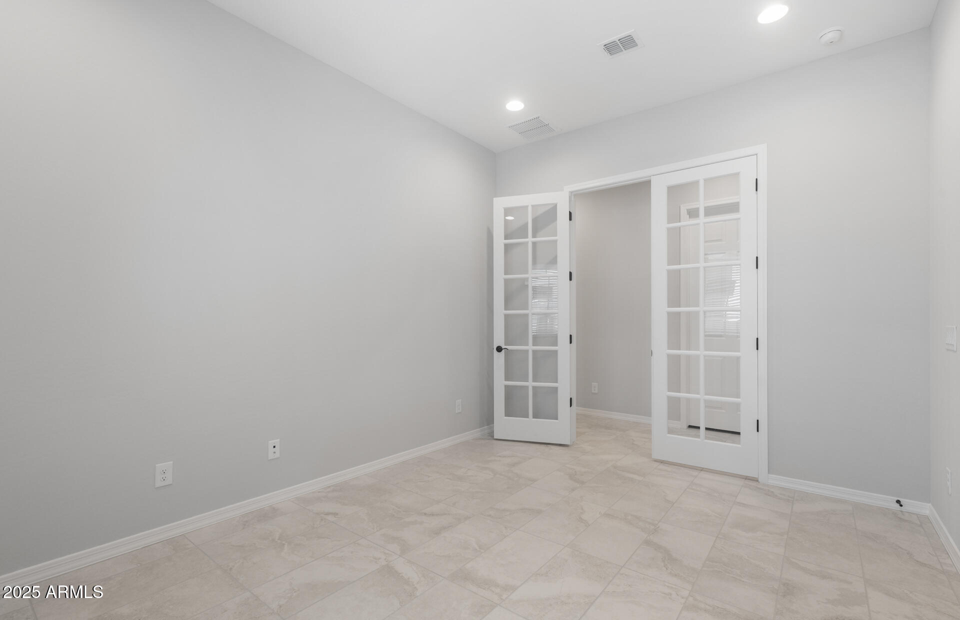 7906 West Mockingbird Way Florence, AZ 85132 - Photo 3 of 36 an empty room with white door and closet