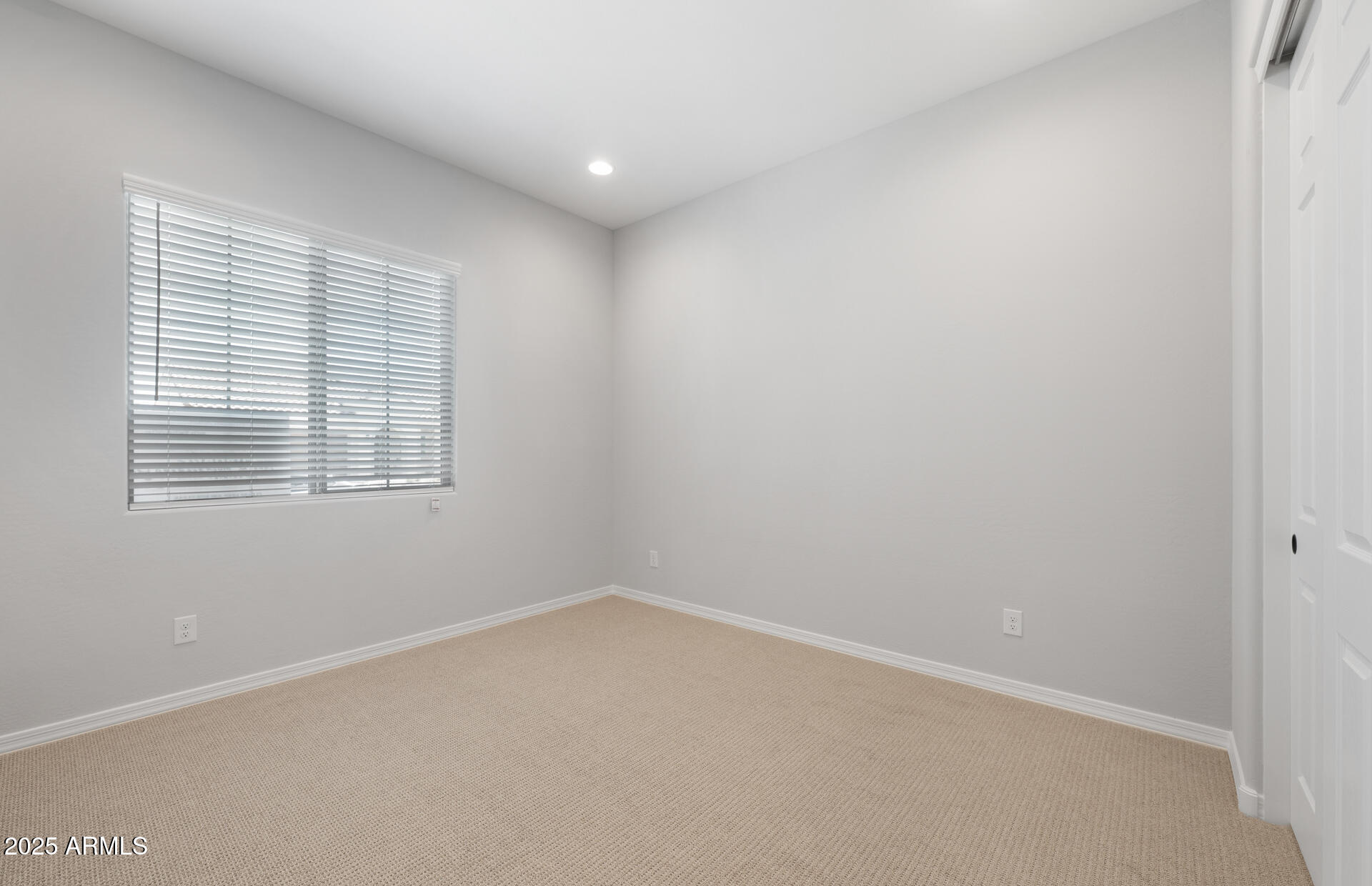 7906 West Mockingbird Way Florence, AZ 85132 - Photo 5 of 36 an empty room with a window