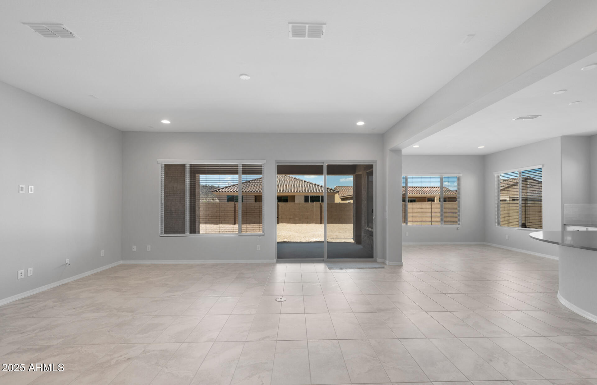 7906 West Mockingbird Way Florence, AZ 85132 - Photo 6 of 36 a view of an empty room with a fireplace and a window