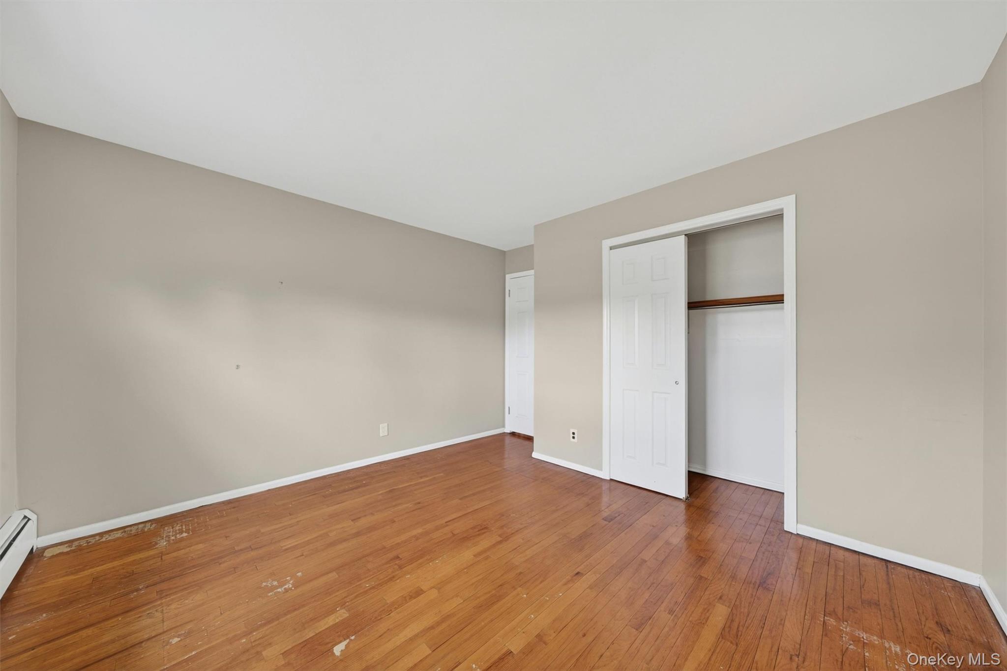 155 Pine Tree Road Monroe, NY 10950 - Photo 26 of 49 a view of an empty room with wooden floor and closet