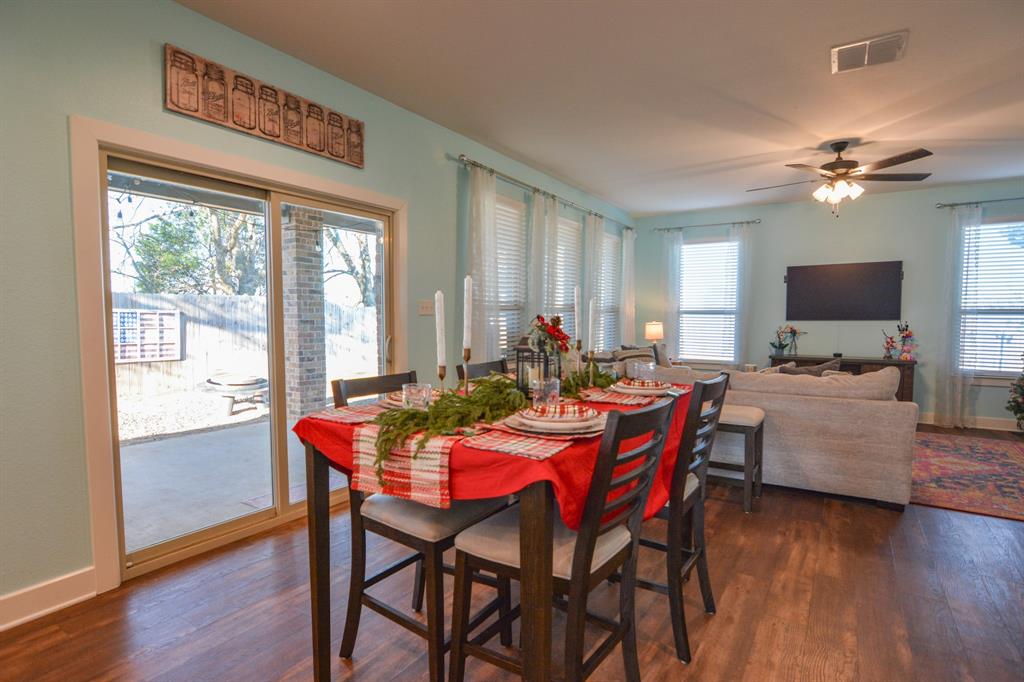 601 Mathew Street Grandview, TX 76050 - Photo 13 of 40 a view of a dining room with furniture window and wooden floor