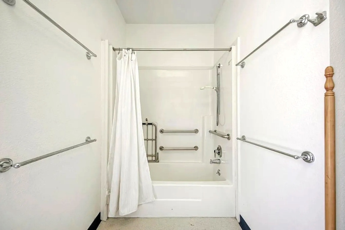 1919 Robbins Place Austin, TX 78705 - Photo 18 of 28 a bathroom with a glass shower door