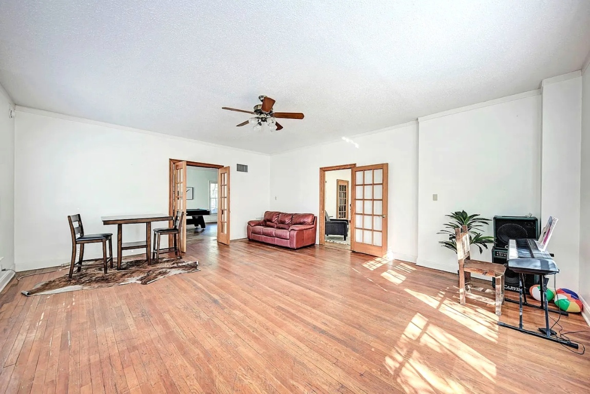 1919 Robbins Place Austin, TX 78705 - Photo 20 of 28 a living room with furniture and a wooden floor