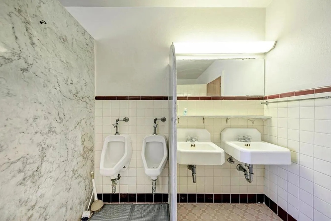 1919 Robbins Place Austin, TX 78705 - Photo 27 of 28 a bathroom with a sink and a mirror