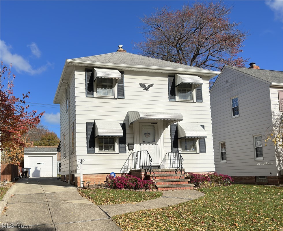 14422 Alger Road Cleveland, OH 44111 - Photo 1 of 16 View of front of house featuring a front lawn and a garage