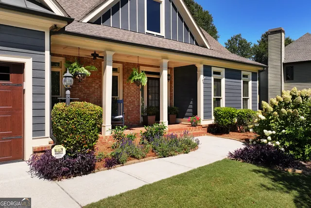a kitchen with stainless steel appliances granite countertop a stove refrigerator and cabinets
