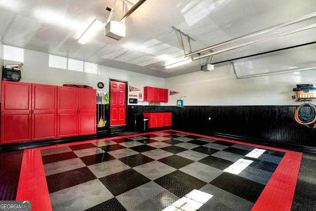 a living room with furniture and a dining table with rug